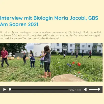 Man sieht Kinder in einem Schulgarten.