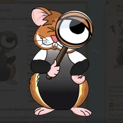 Man sieht einen Hamster, der durch eine Lupe schaut.